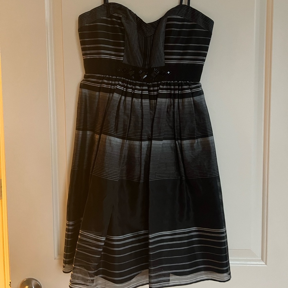 Women’s black, gray, and white studded sleeveless dress.
